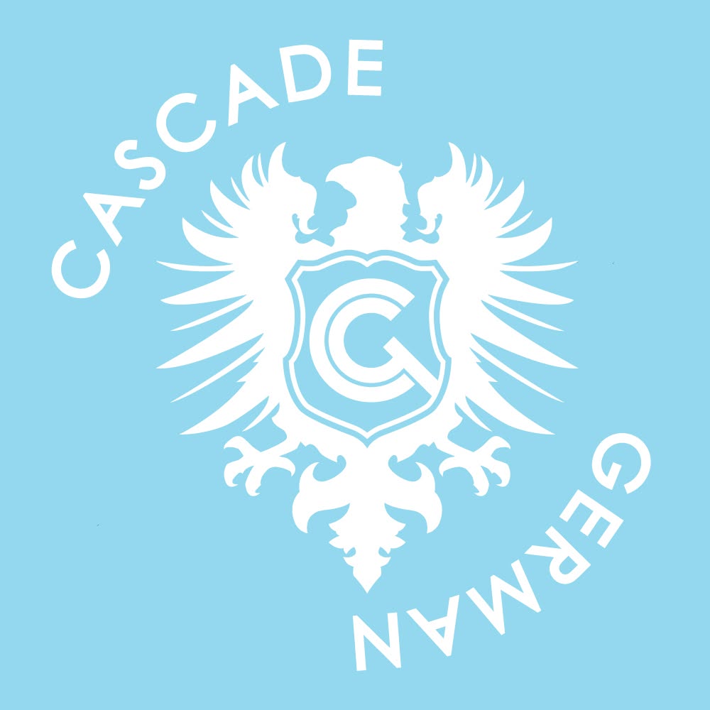 A light blue background with a white emblem of a double-headed eagle holding a shield, and the words 'Cascades' and 'Germán' curved around it.