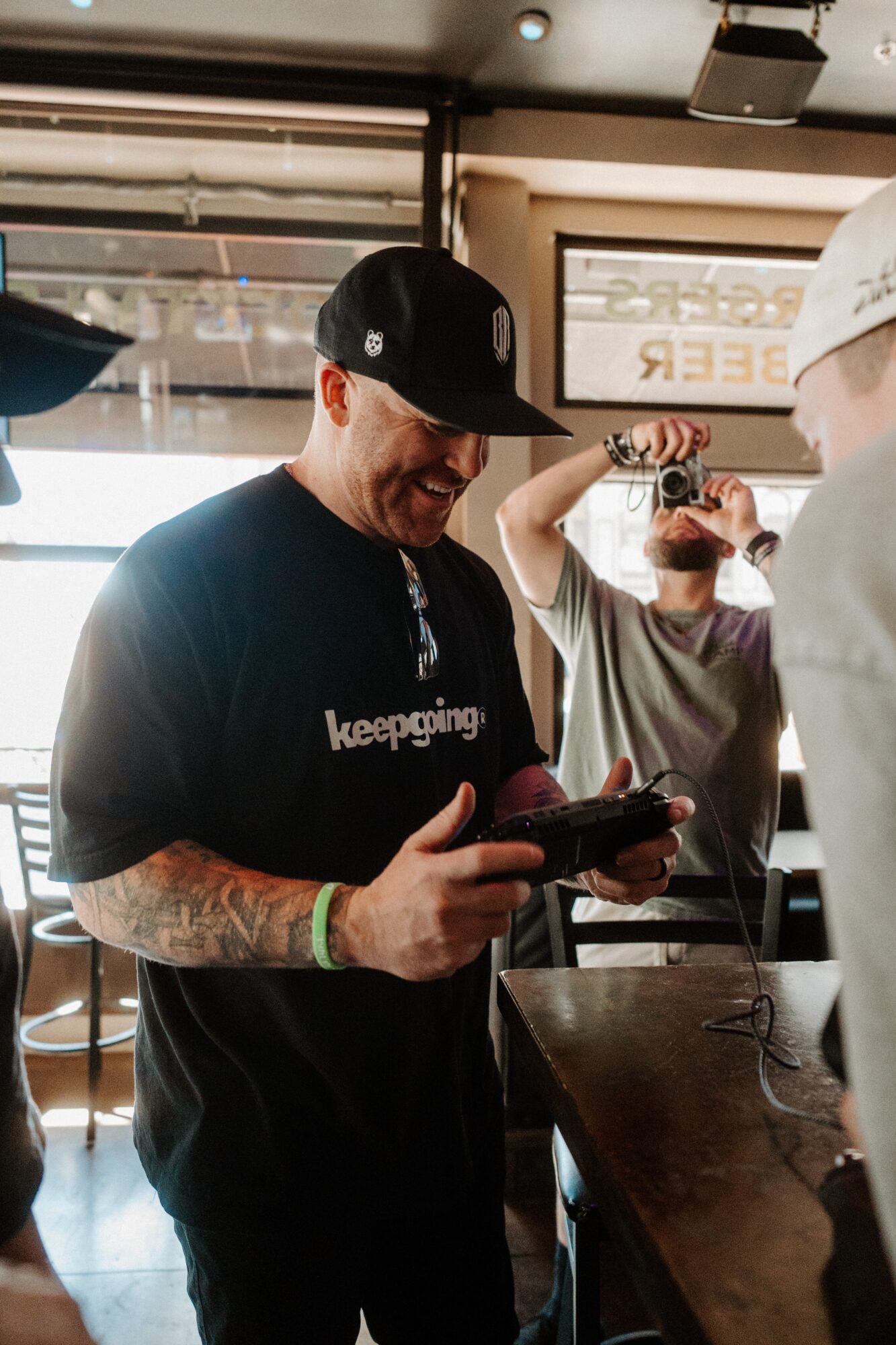 Person wearing a black cap and t-shirt with