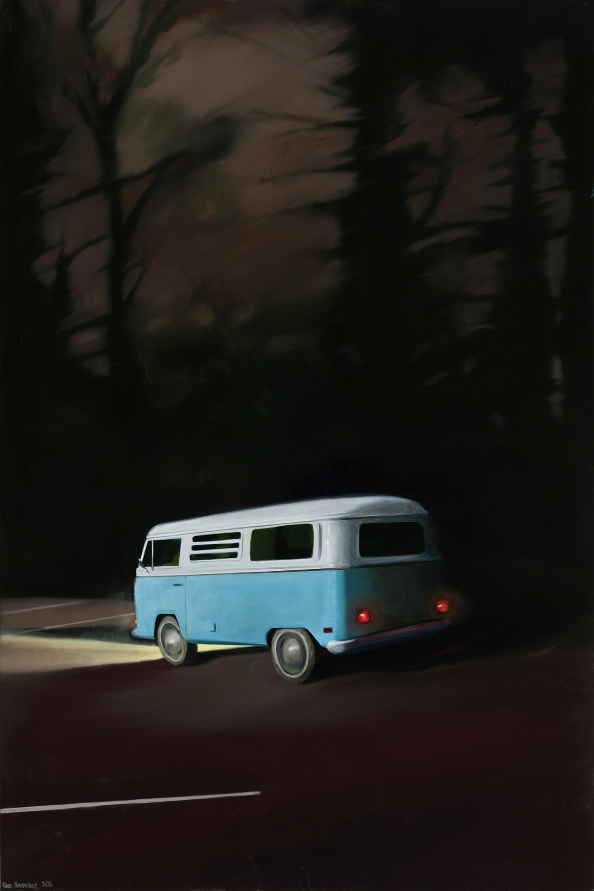 Blue van parked on a road with trees and dark sky in the background.