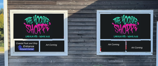 Two signs on a building with black backgrounds and colorful text, advertising The Hood Shoppe, with additional information below.