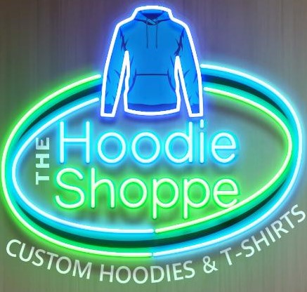 Neon sign with a blue hoodie above the text 'The Hoodie Shoppe' and 'Custom Hoodies & T-Shirts' below, on a dark background.