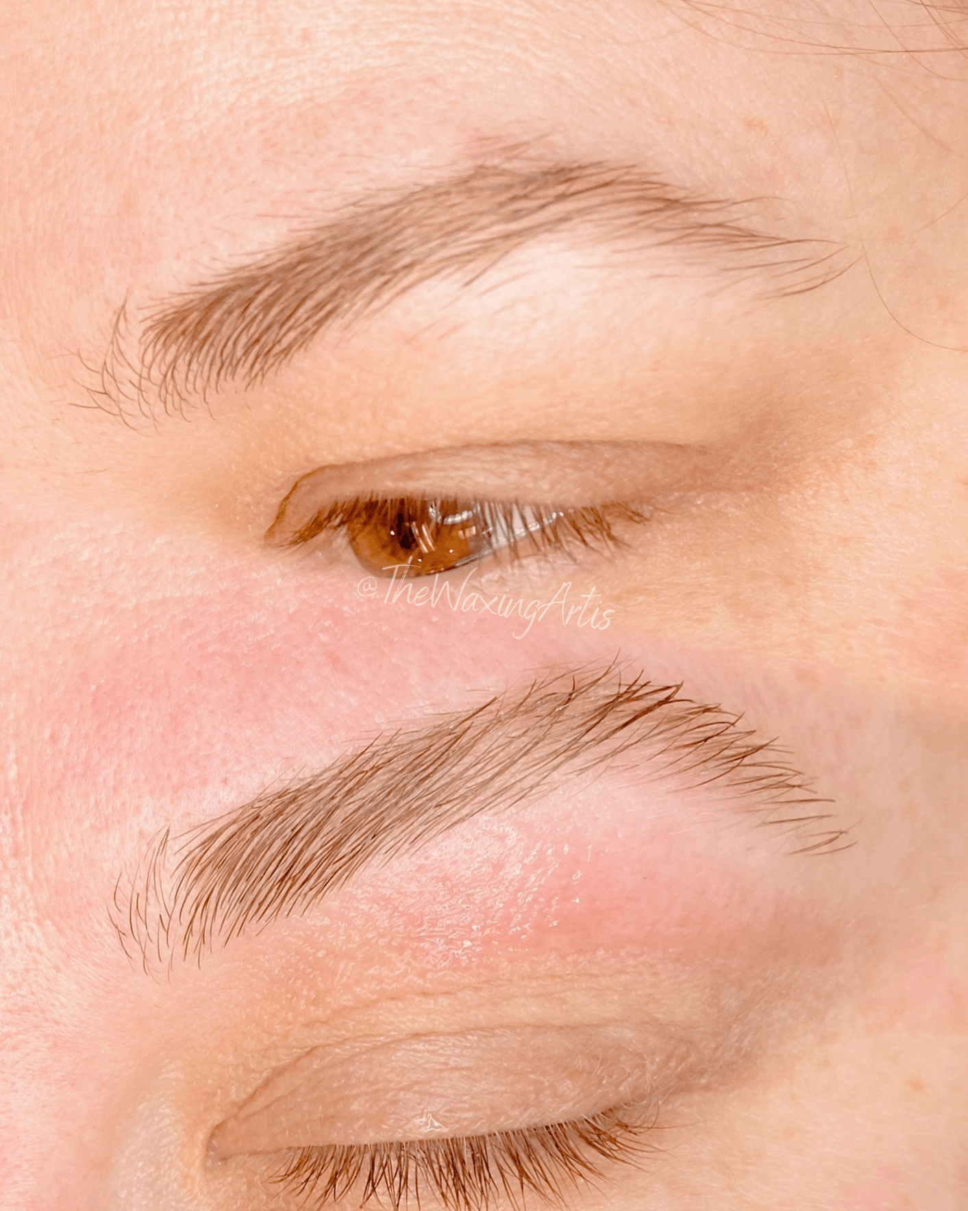 Close-up of a person's eye with eyebrows, showing the eye closed and the skin around it.
