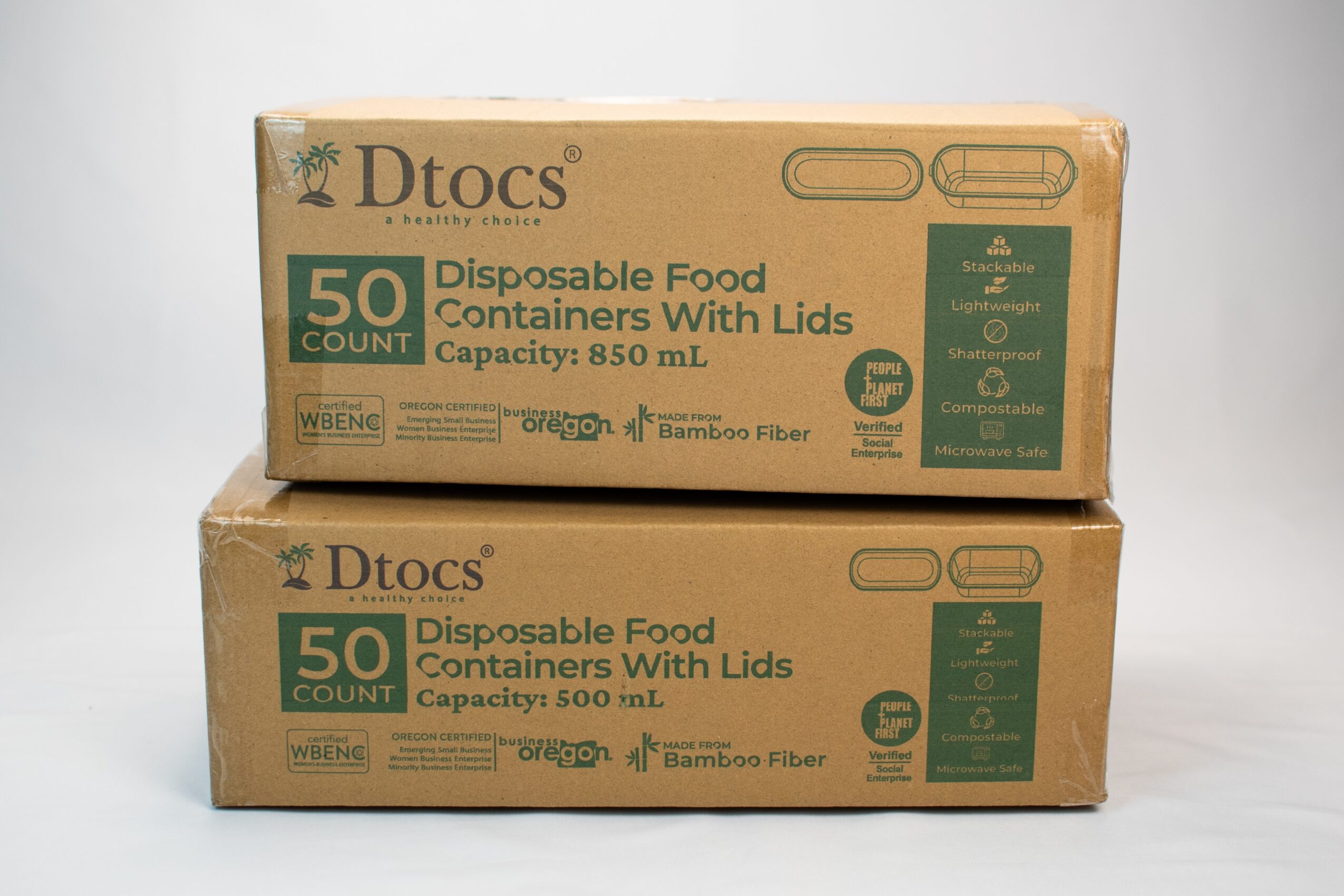 Two stacked cardboard boxes labeled Dtocs, containing 50 disposable food containers with lids, capacity 850 mL and 500 mL, on a plain background.
