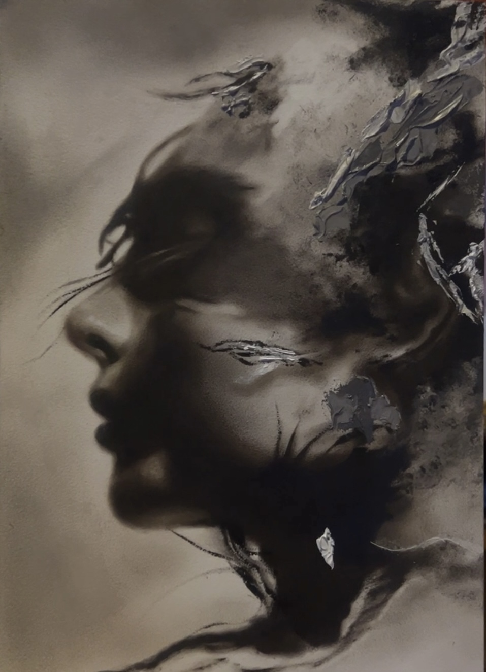 A surreal portrait of a woman's face blending with abstract dark shapes and textures, creating a dreamlike atmosphere.
