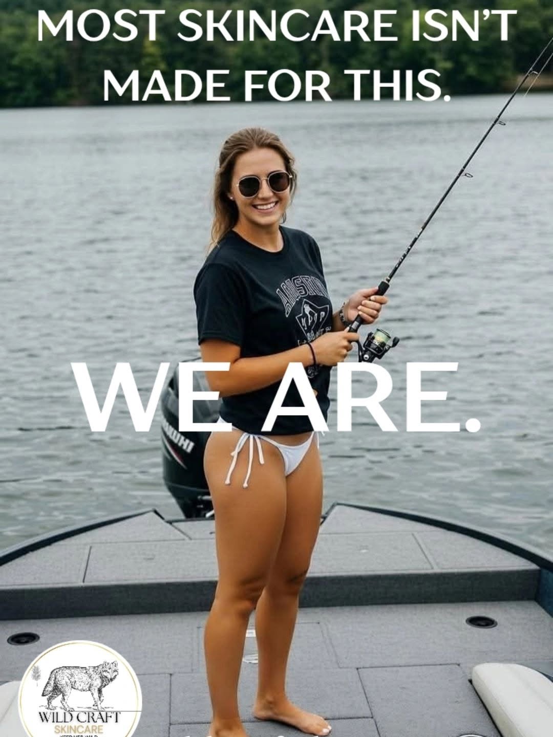 Woman in sunglasses holding fishing rod on boat, water background, smiling, wearing black t-shirt and shorts.