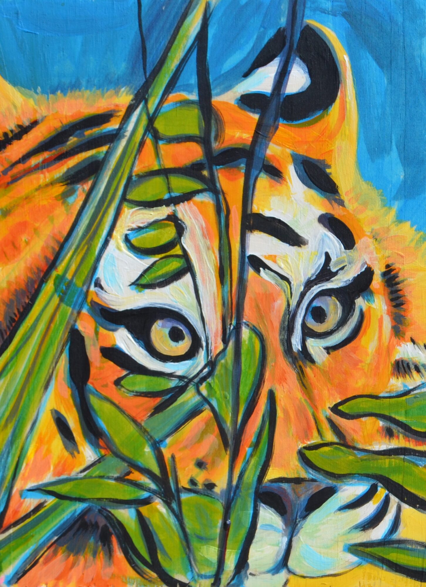 A tiger's face partially obscured by green leaves and bamboo, with vivid orange, black, and white fur, and piercing eyes.