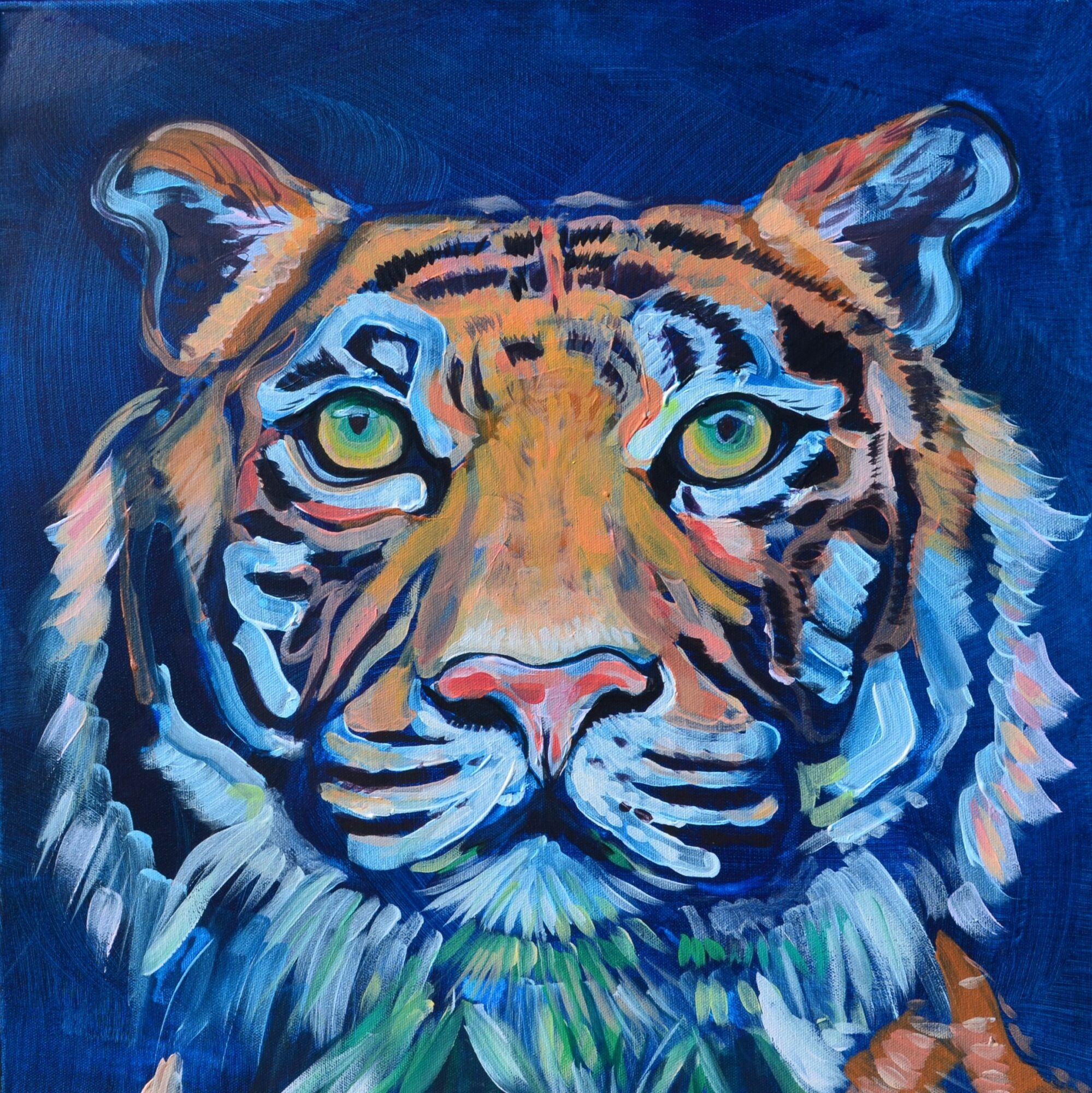 A colorful painting of a tiger's face with green eyes against a dark blue background.