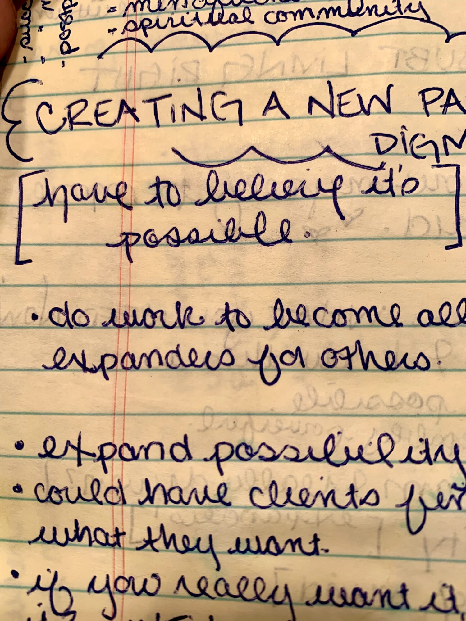 Handwritten notes on paper discussing creating a new page, delivering it, expanding possibilities, and client needs.