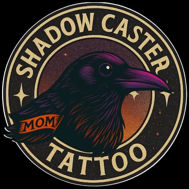 Circular logo with a black bird's head, text 'Shadow Caster Tattoo', and a small orange banner with 'MOM'.
