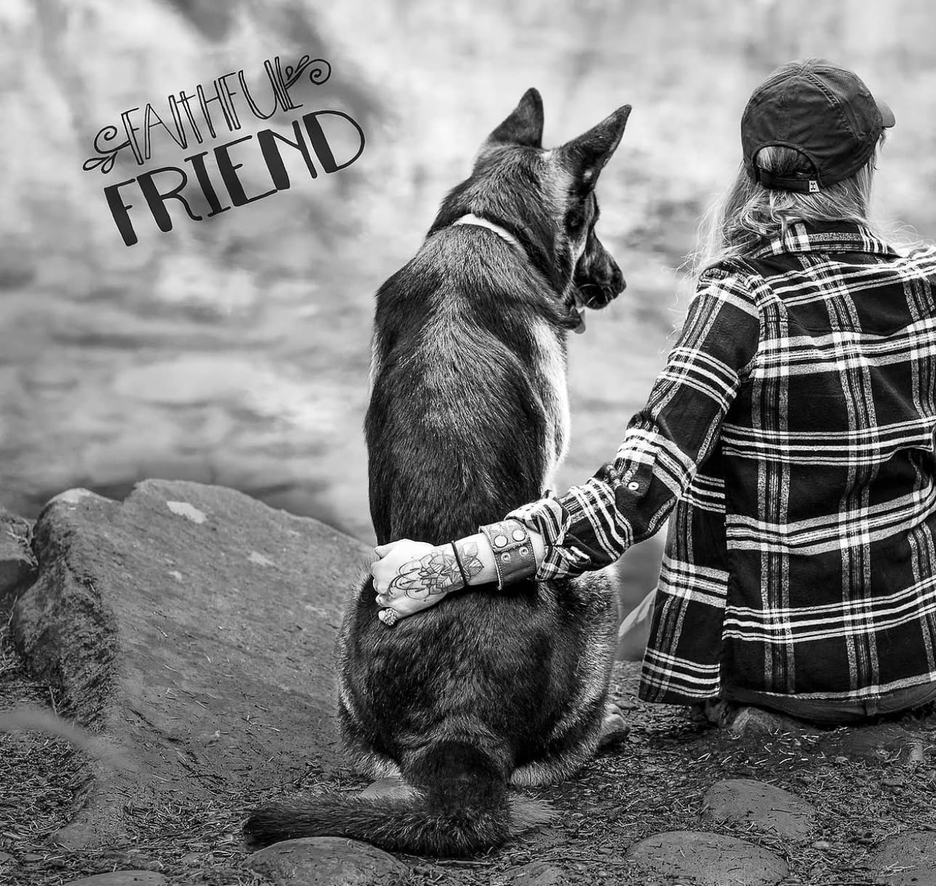 Person and dog sitting on rocks by water, holding hands, with text 'Faithful Friend' in the top left corner.