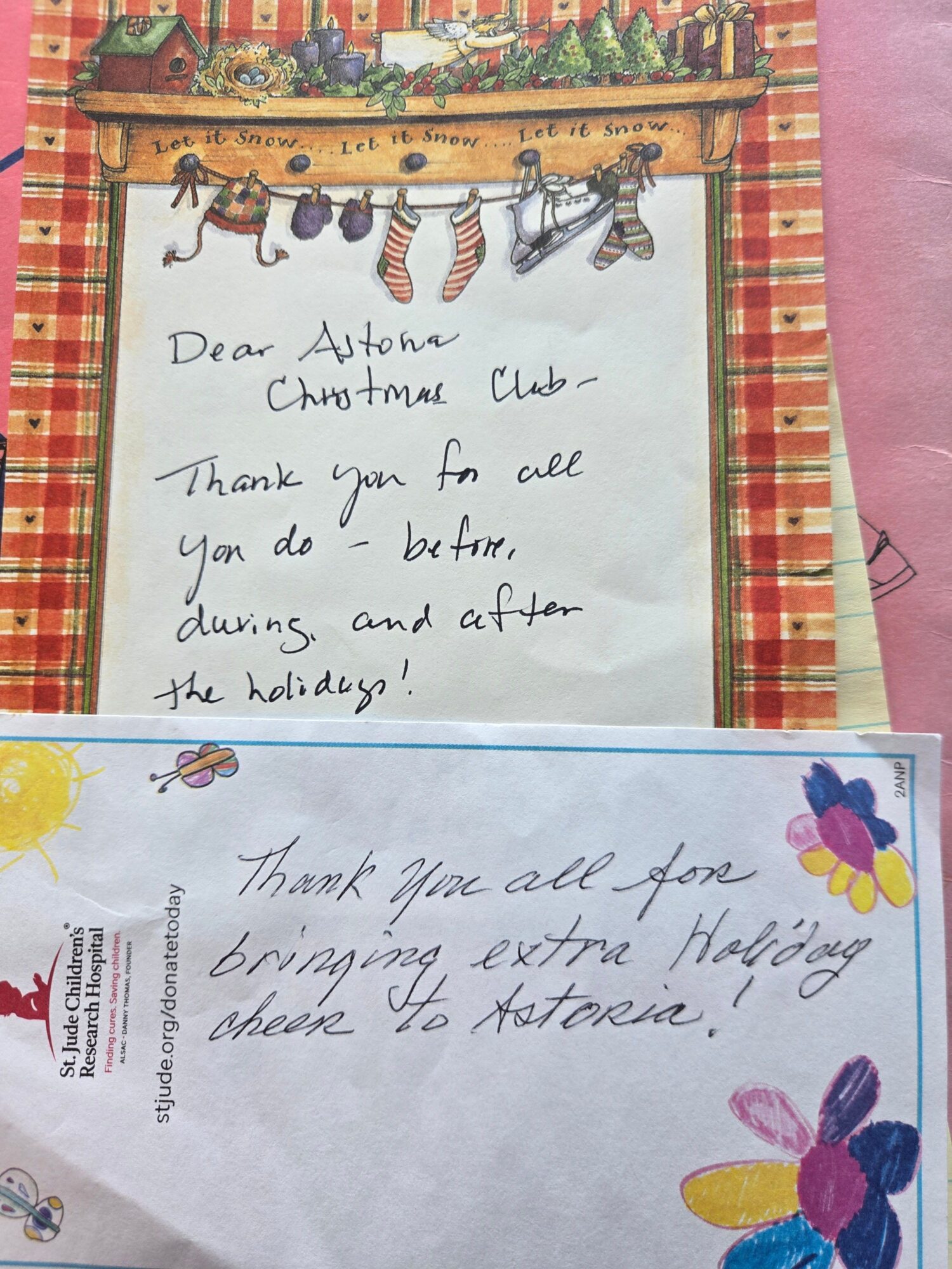 Two handwritten notes on decorated paper, one with a butterfly and animal border, the other with colorful flower drawings, expressing thanks.